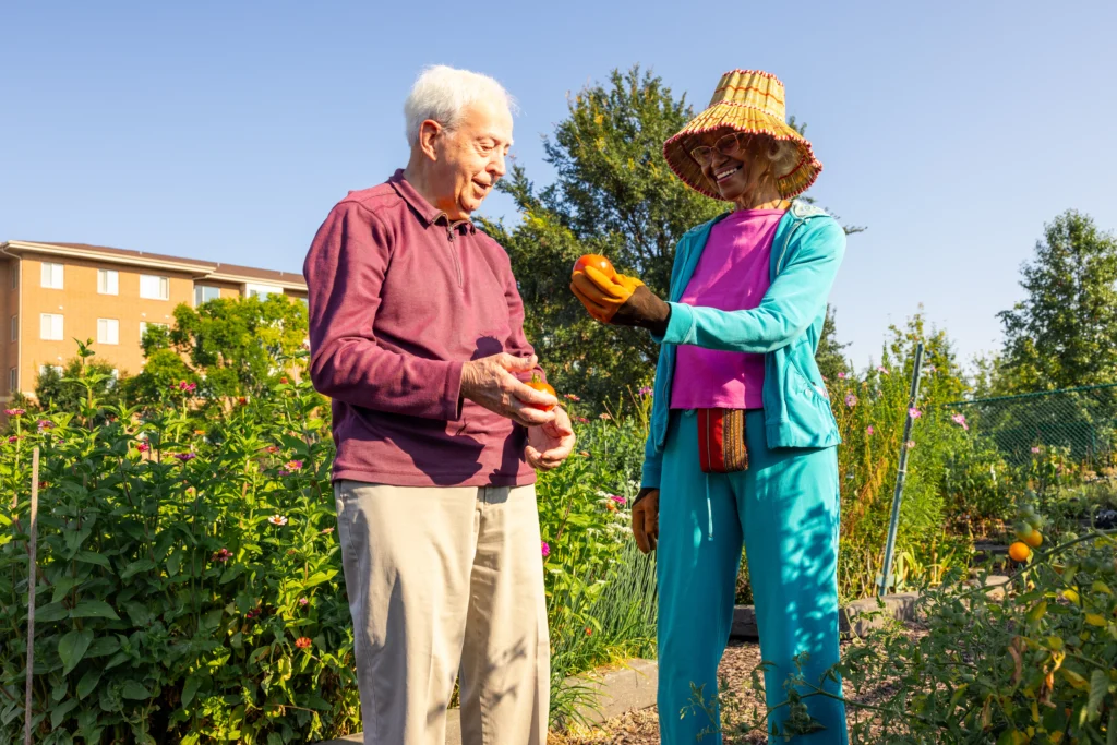 Monarch Landing man and woman show how gardening can foster friendship in senior living communities