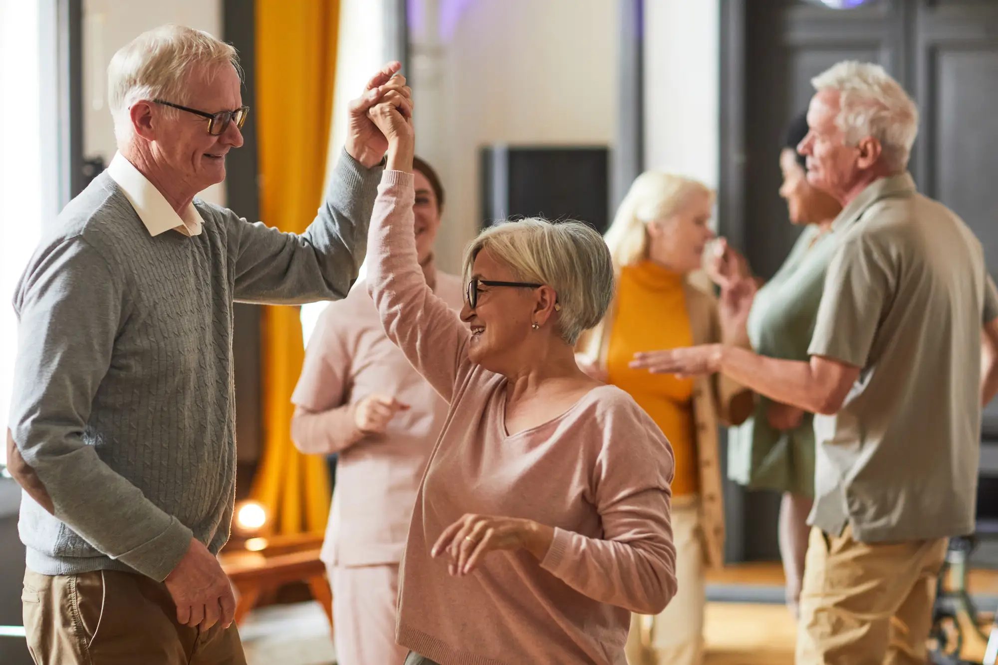 Active senior couples dancing at Monarch Landing, a independent living community in Naperville, IL.