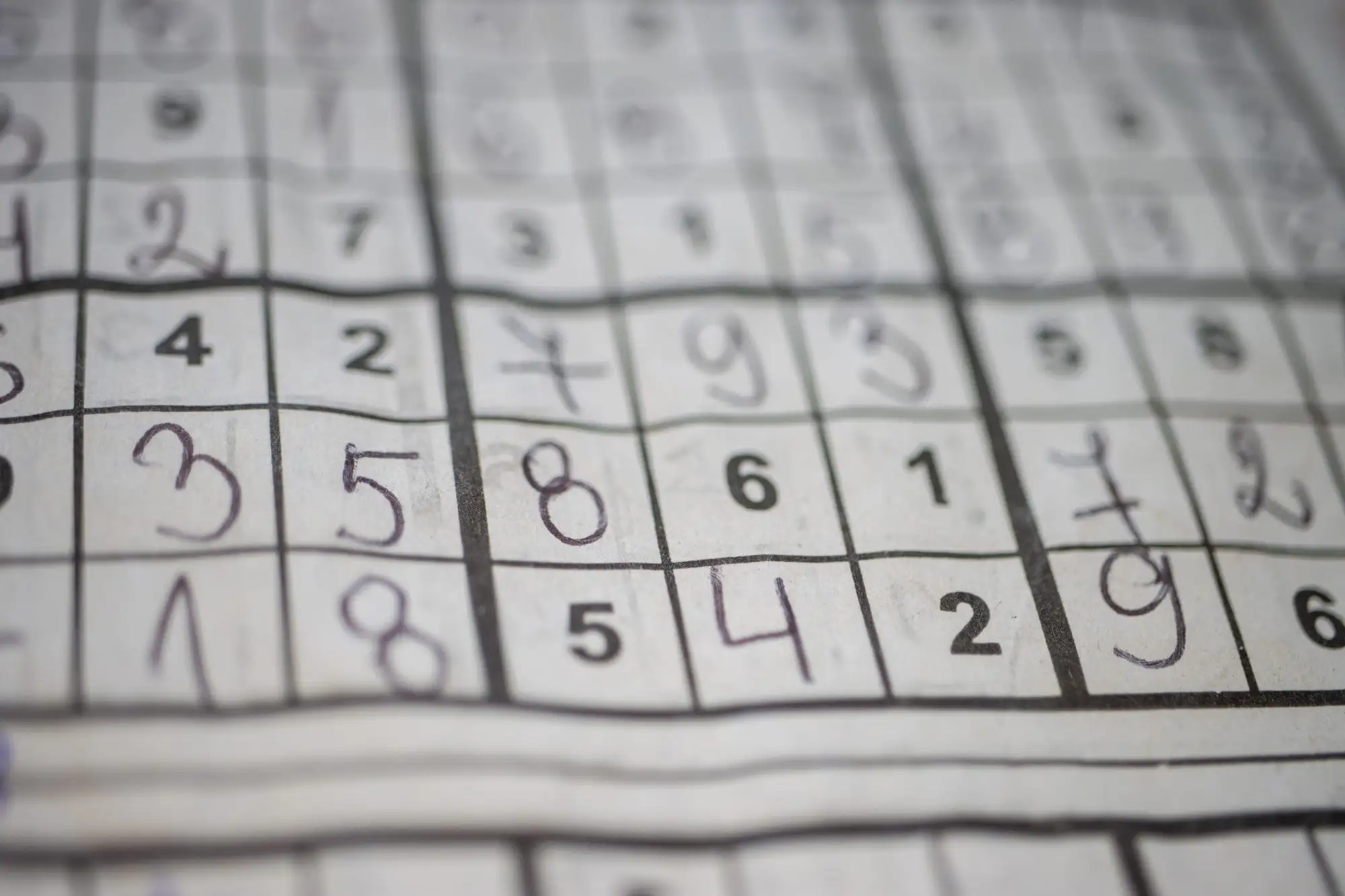 An image of a solved sudoku puzzle in a newspaper, one of the best brain games for seniors.