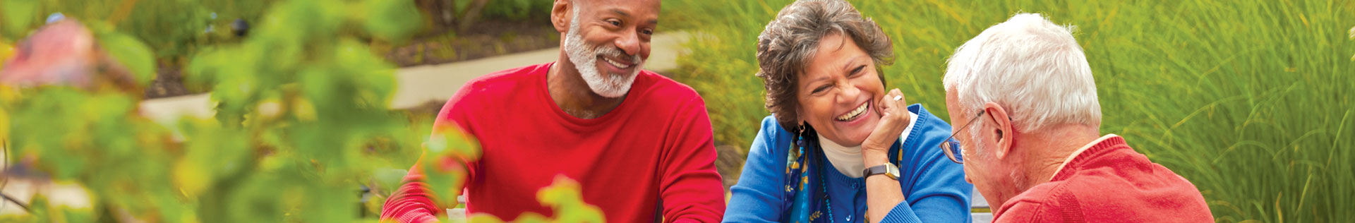 Three seniors sitting and talking