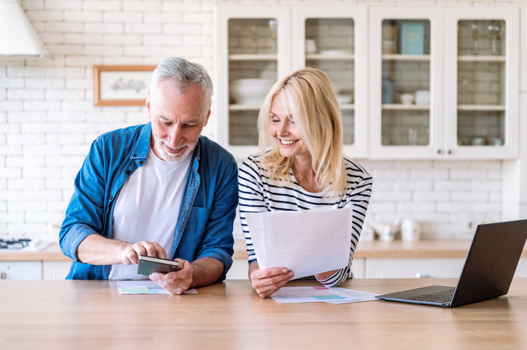 Senior couple looking at papers for retirement planning tips