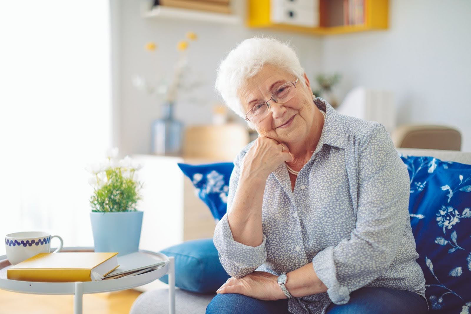 Senior woman enjoying her apartment living Senior woman enjoying her apartment living