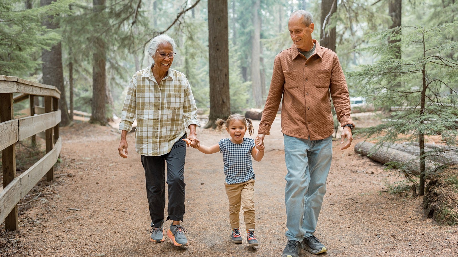 Senior couple enjoying a hike An active and healthy senior couple while hiking together through a forest in the Pacific Northwest region of the United States.